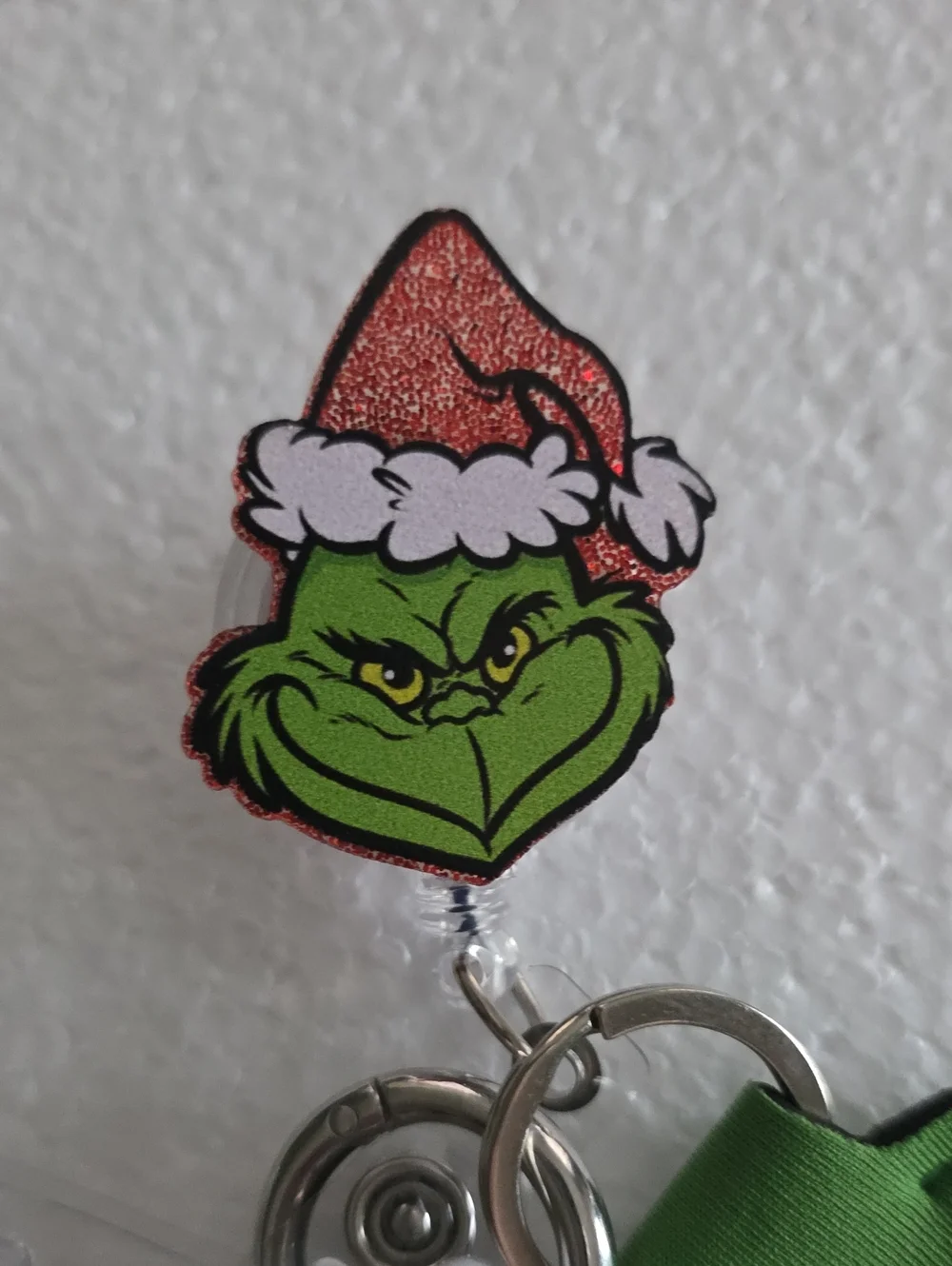 Grinch With Santa Hat Badge Reel